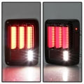 Picture of Spyder 07-16 Jeep Wrangler Version 2 Light Bar LED Tail Lights - Smoke ALT-YD-JWA07V2-LBLED-BSM