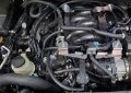 Picture of J&L 16-24 Nissan Titan 5-6L Passenger Side Oil Separator 3-0 - Black Anodized