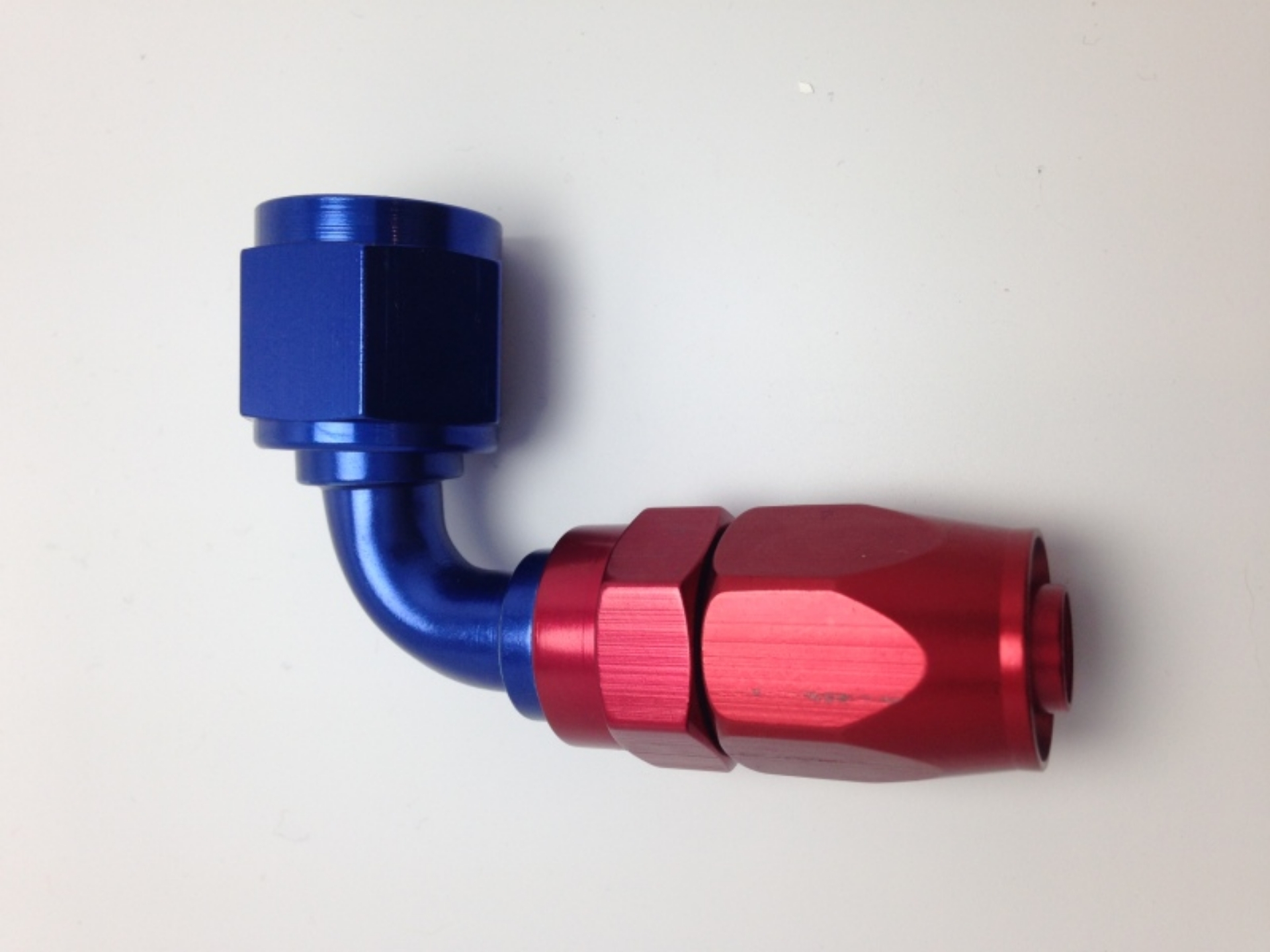Picture of Fragola -10AN Nut x -12AN Hose 90 Degree Reducing Hose End - Blue-Red
