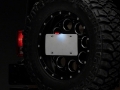 Picture of Raxiom 07-18 Jeep Wrangler JK Axial Series License Plate Bracket w- LED Brake Light