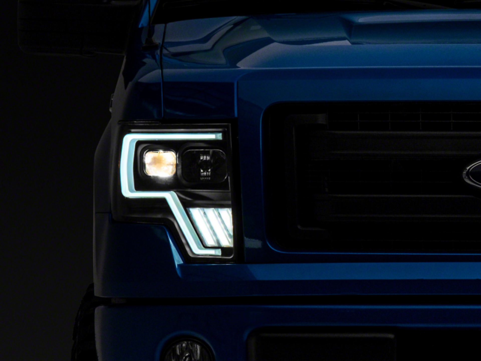 Picture of Raxiom 09-14 Ford F-150 Axial G4 Light Bar Switchback Projector Headlights- Blk Housing Clear Lens