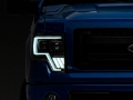 Picture of Raxiom 09-14 Ford F-150 Axial G4 Light Bar Switchback Projector Headlights- Blk Housing Clear Lens