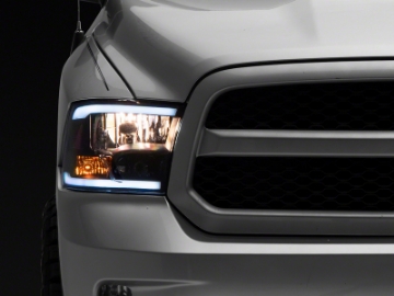 Picture of Raxiom 09-18 Dodge RAM 1500-2500-3500 Axial Headlights w- SEQL LED Bar- Blk Housing Clear Lens