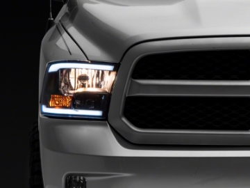 Picture of Raxiom 09-18 Dodge RAM 1500-2500-3500 Axial Series Headlights w- LED Bar- Blk Housing Clear Lens