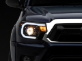 Picture of Raxiom 12-15 Toyota Tacoma Axial Series Projector Headlights w- LED Bar- Blk Housing Clear Lens