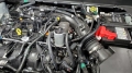 Picture of J&L 19-24 Ford-Lincoln SUVs & Trucks w 2-0 EcoBoost Driver Side Oil Separator 3-0 - Clear An