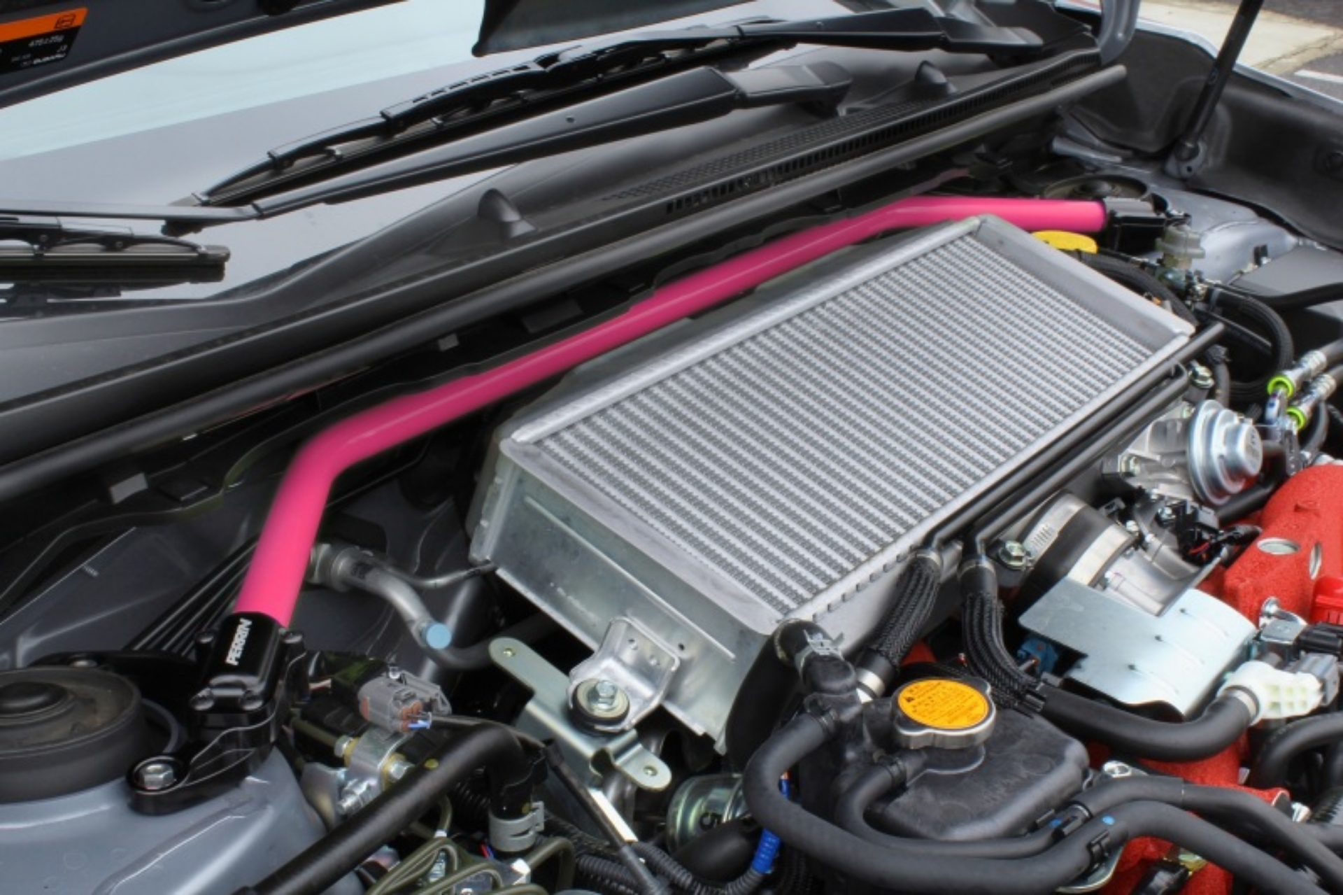 Picture of PERRIN 08-14 WRX-STI-Impreza - 14-18 Forester - 13-17 Crosstrek - 05-09 Legacy FR Strut Brace - Pink
