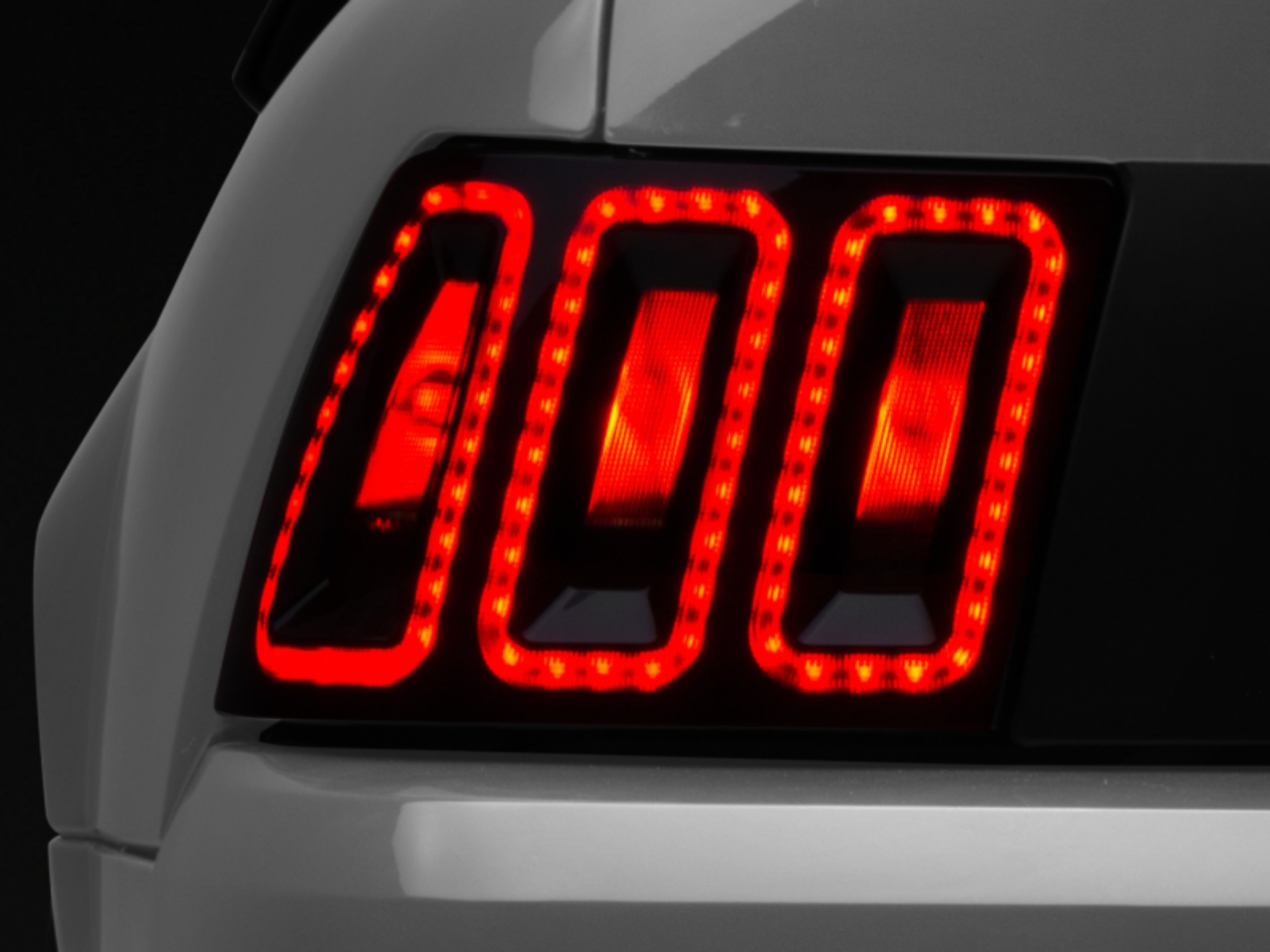 Picture of Raxiom 99-04 Ford Mustang Excluding 99-01 Cobra Icon LED Tail Lights- Black Housing Smoked Lens