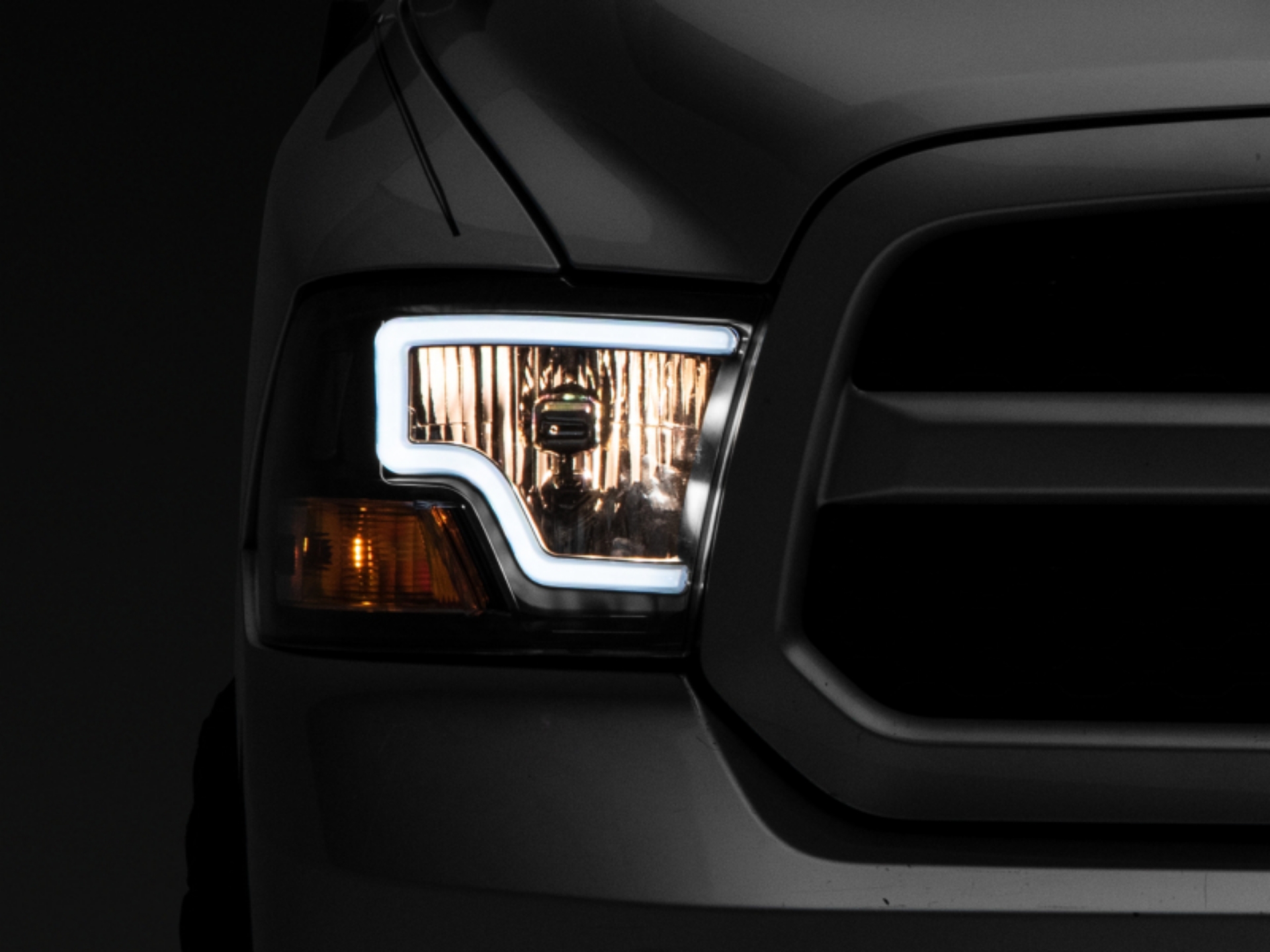 Picture of Raxiom 09-18 Dodge RAM 1500 LED Bar Headlights- Black Housing Clear Lens