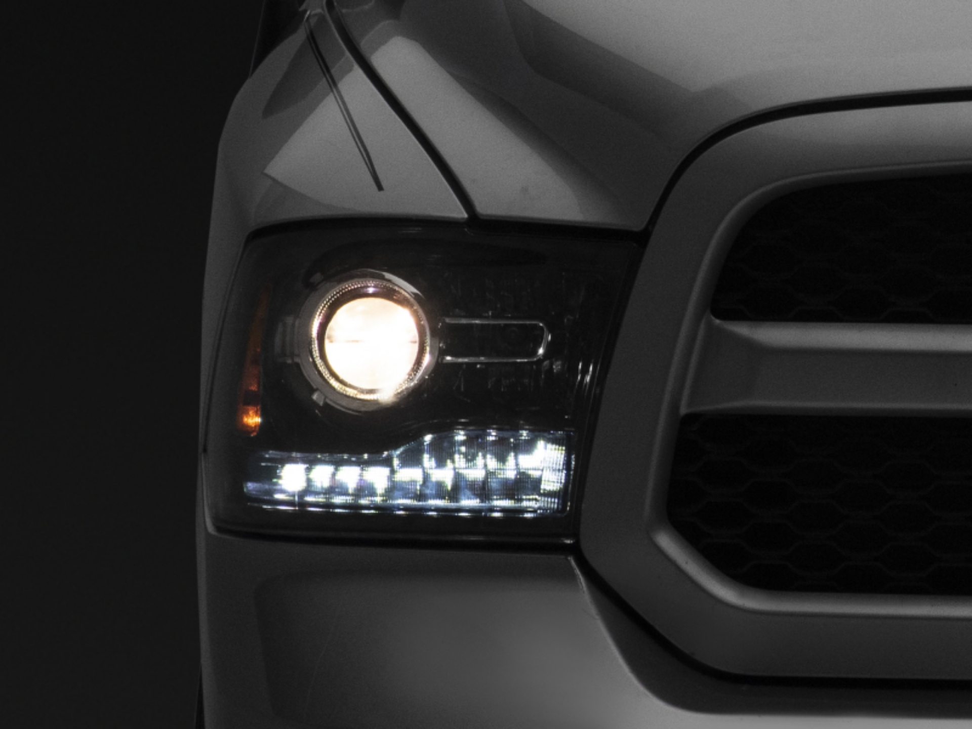 Picture of Raxiom 09-18 Dodge RAM 1500 LED Halo Headlights w-Switchback Turn Signals- Blk Housing Clear Lens